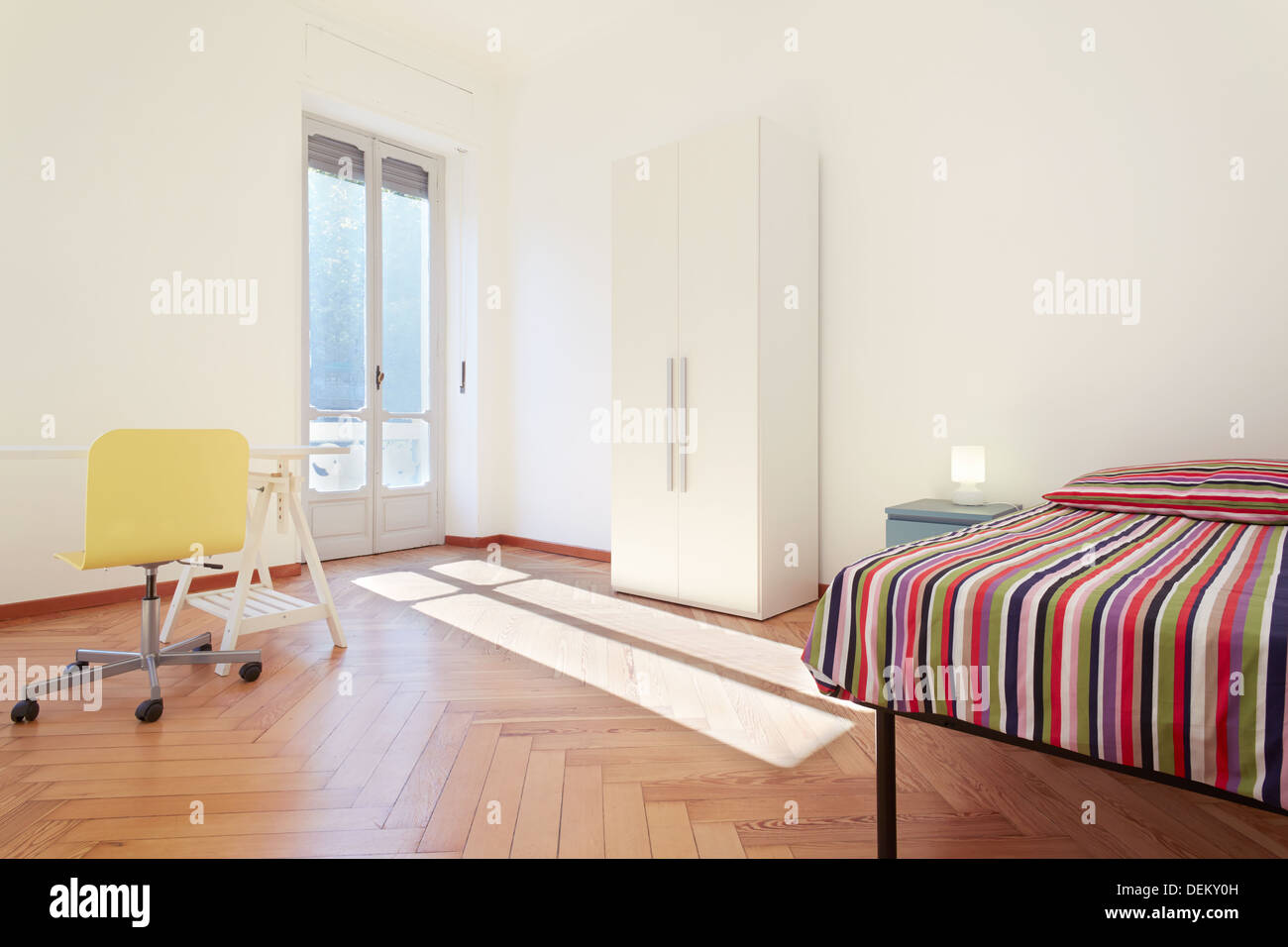 Single bedroom, modern interior design in sunny apartment Stock Photo