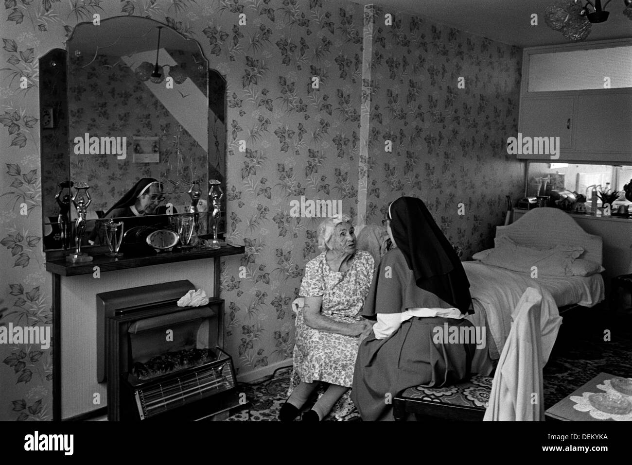 Anglican nun visiting members of the community in East London Stock