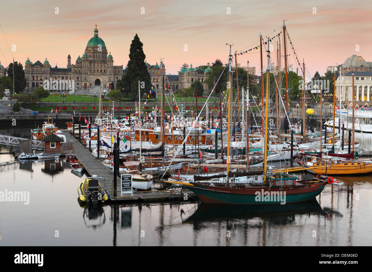 Classic wooden boats in Inner harbor marina and Legislative buildings