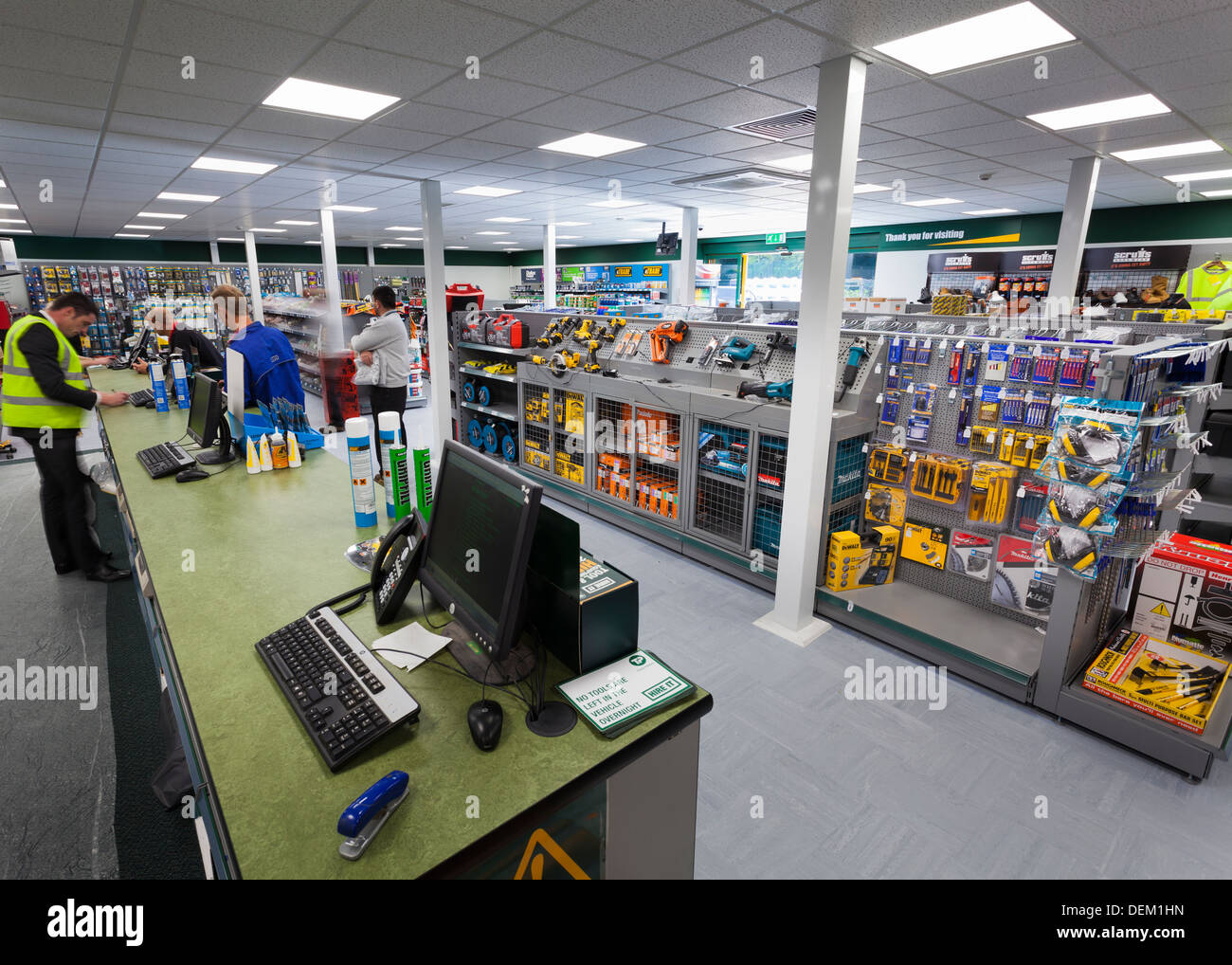 customers at sales counter in Travis Perkins Builders Merchants shop