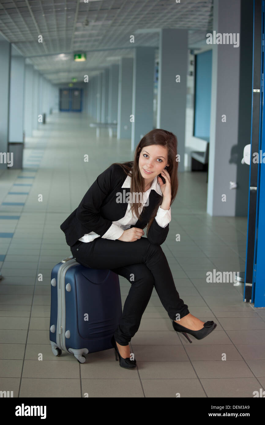 Business woman standing in airport hi-res stock photography and images ...