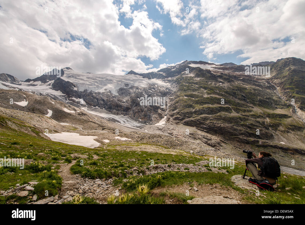 Young lady photographing the Austrian Alps near Obergurgl Tyrol Austria Europe Stock Photo