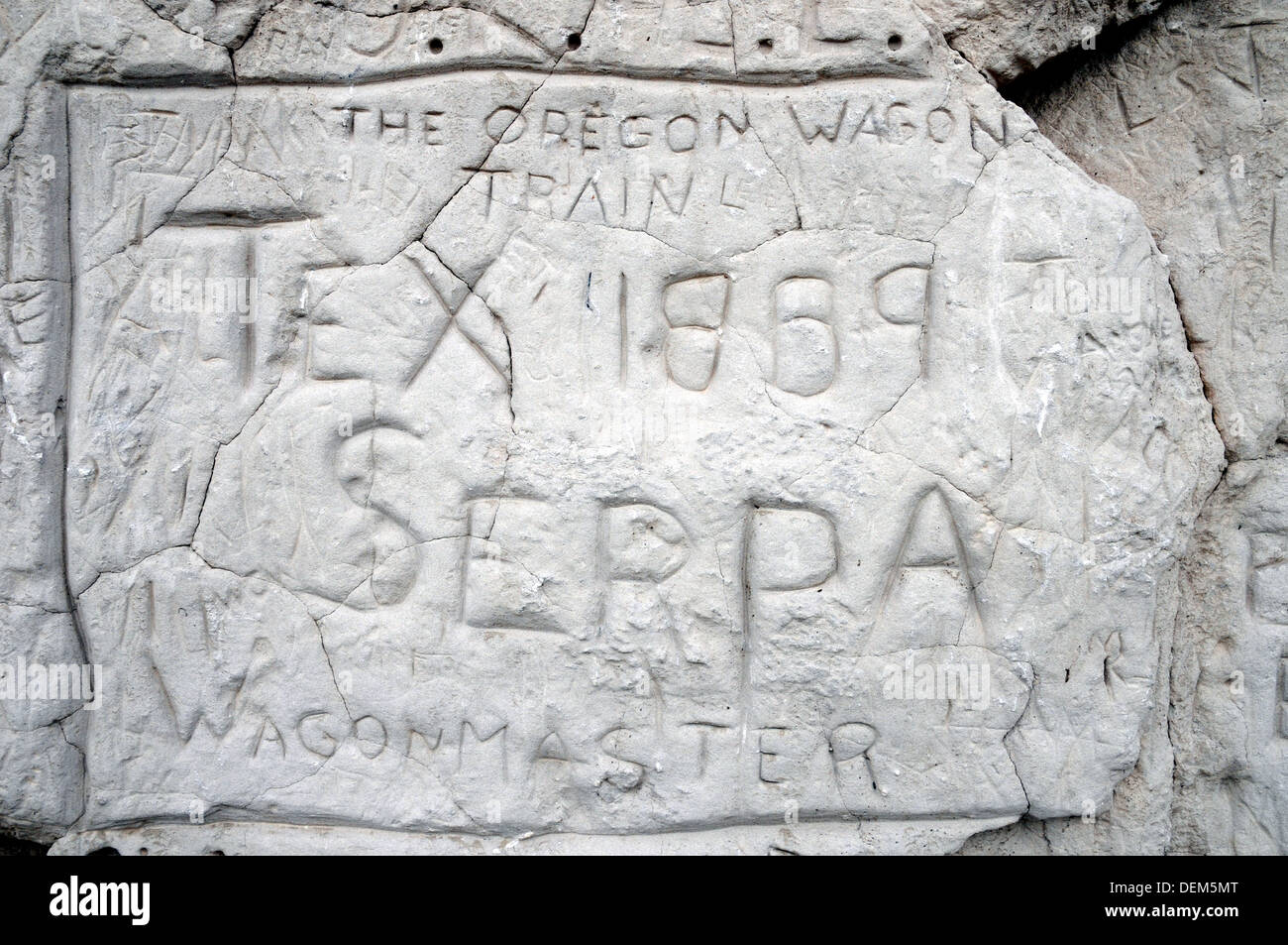 The name of an 700 carved their names hemigrant and user of the Oregon Trail carved into the soft sandstone at Register Cliff, near Guernsey, Wyoming. Stock Photo