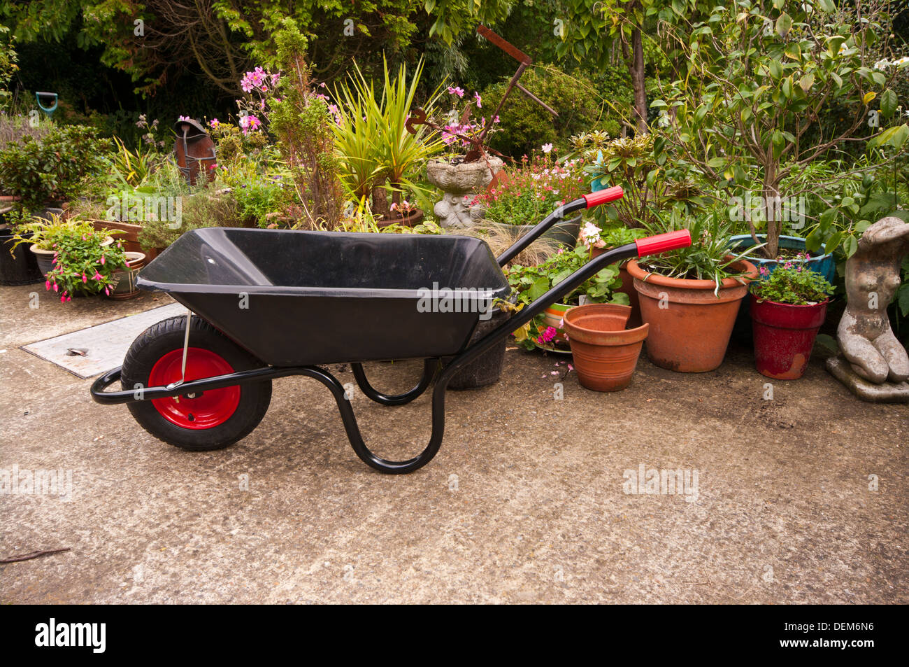 Empty Wheelbarrow In A Cottage Flower Garden Stock Photo Alamy