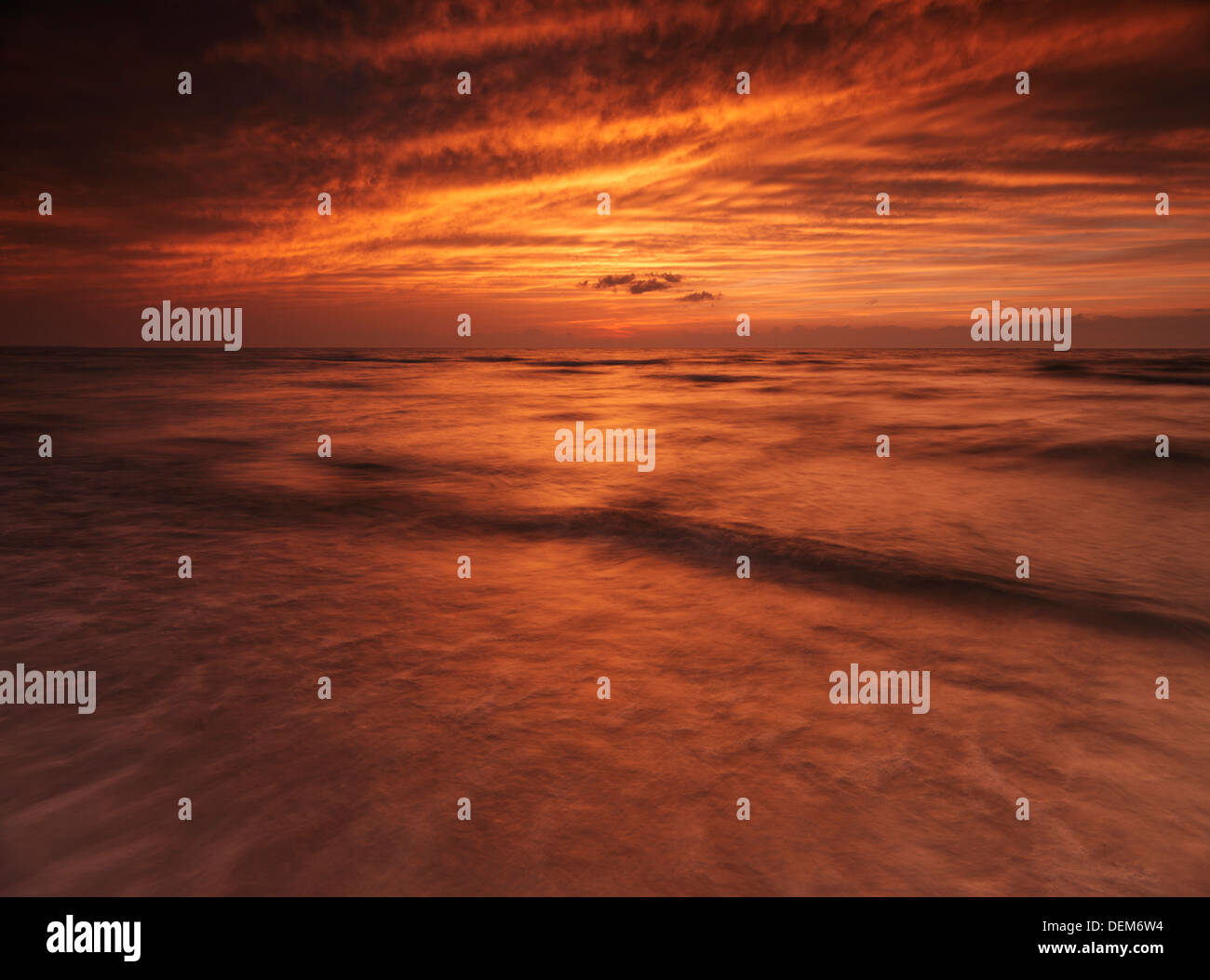 Sunset nature scenery of lake Huron with beautiful dramatic bright red sky. Ontario, Canada. Stock Photo