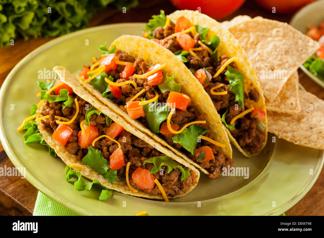 Homemade Ground Beef Tacos with Lettuce, Tomato, and Cheese Stock Photo