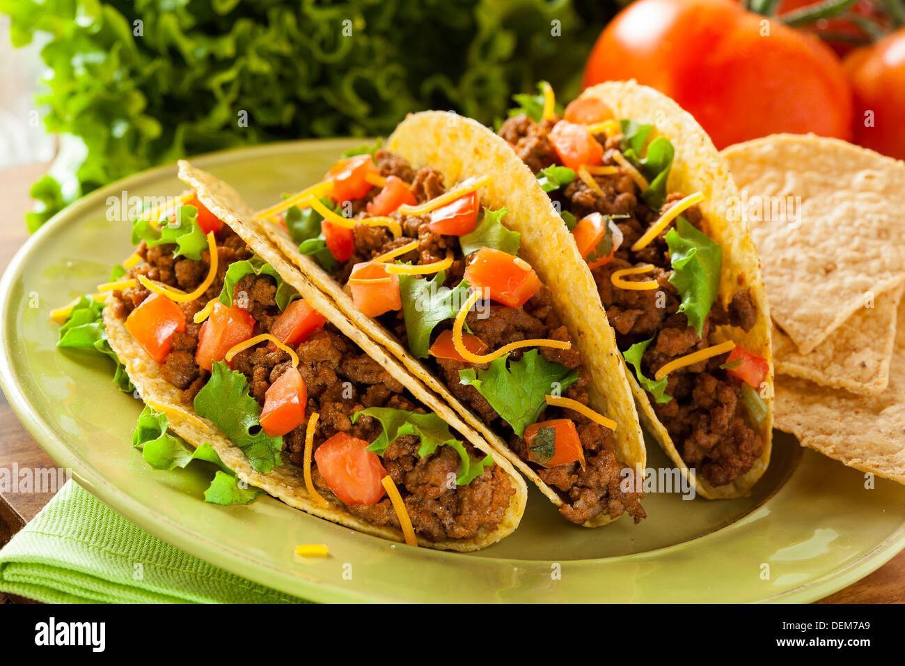 Homemade Ground Beef Tacos with Lettuce, Tomato, and Cheese Stock Photo