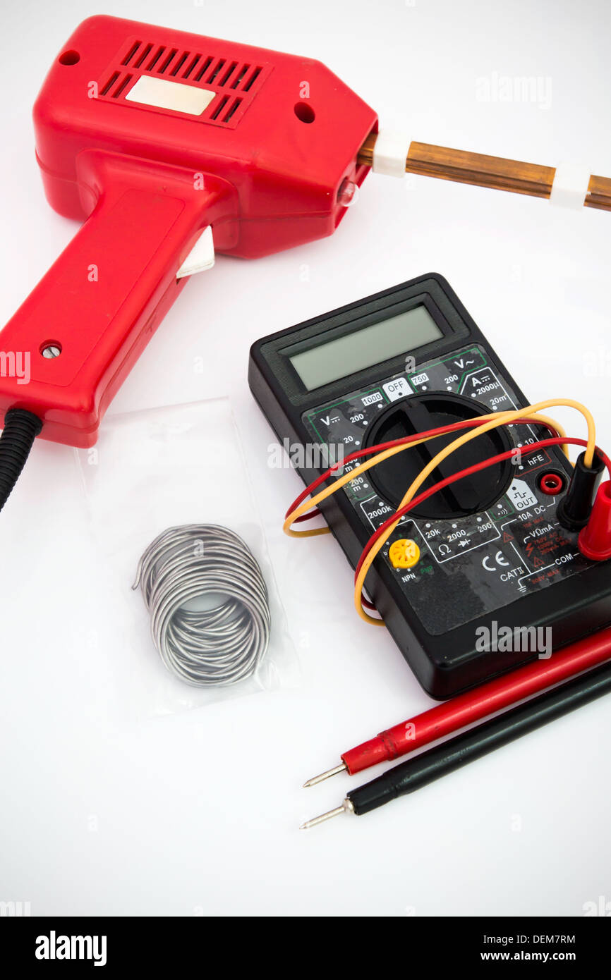 Soldering tool, multimeter on white background Stock Photo