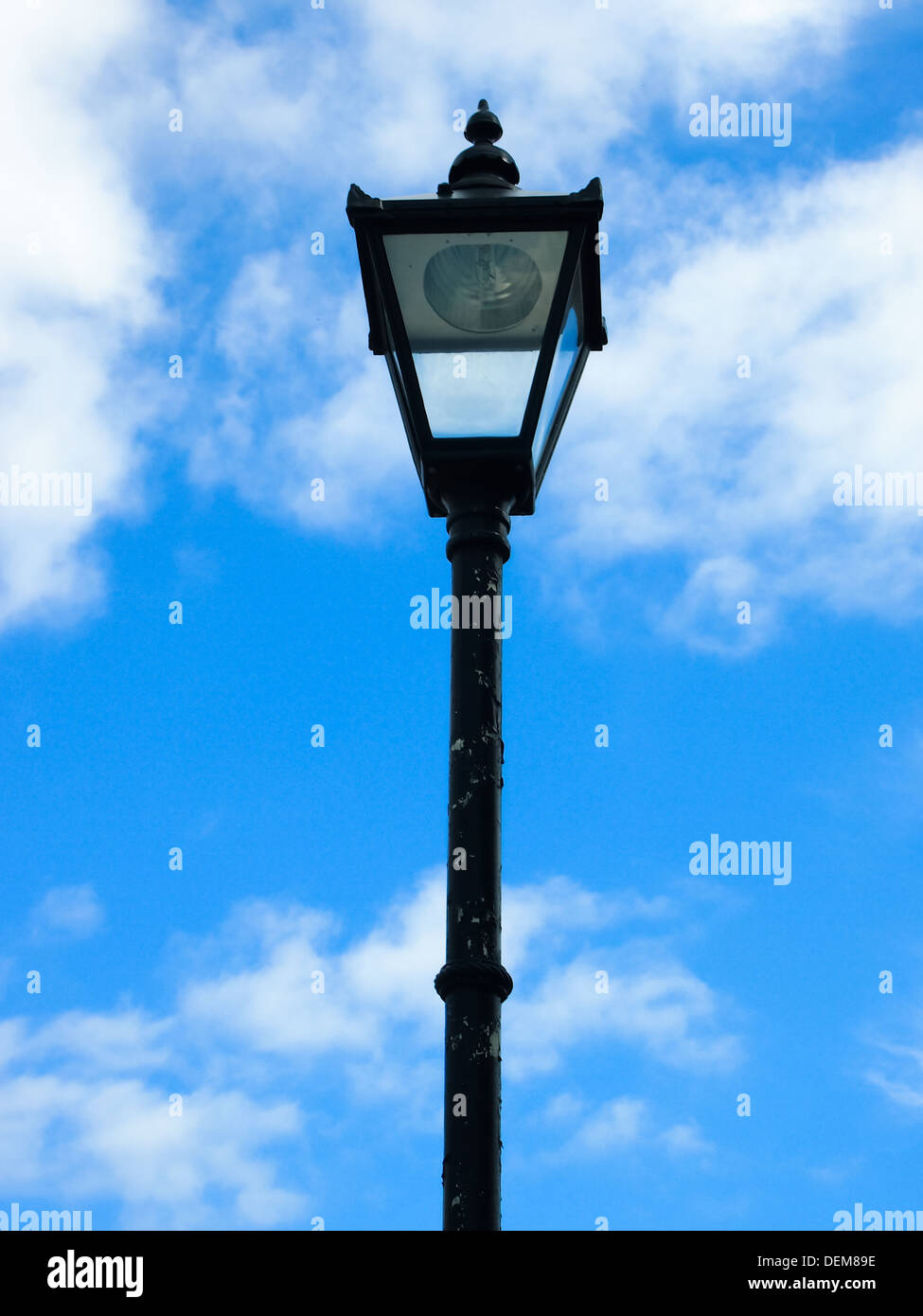 A retro style electric street lamp in the shape of a gas lamp. Stock Photo