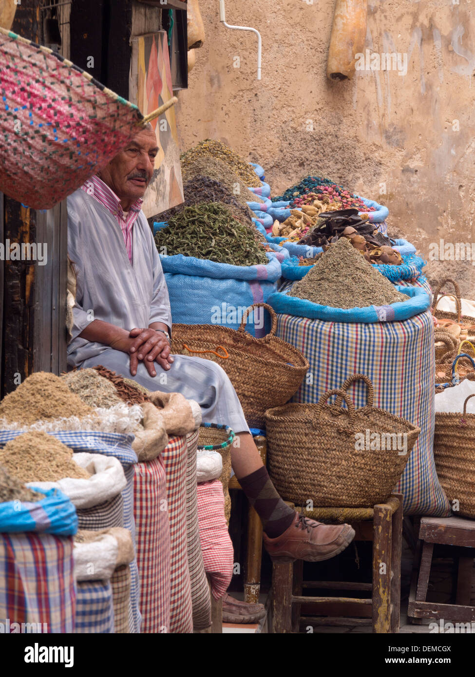 Man selling goods at the medina souk, Marrakech, Morocco Stock Photo