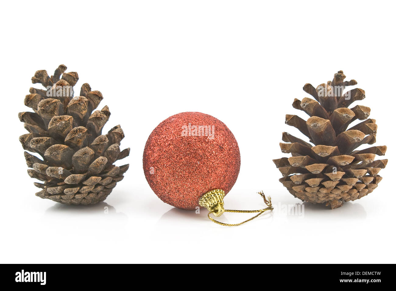 Red Christmas bauble with pine cones isolated on white Stock Photo