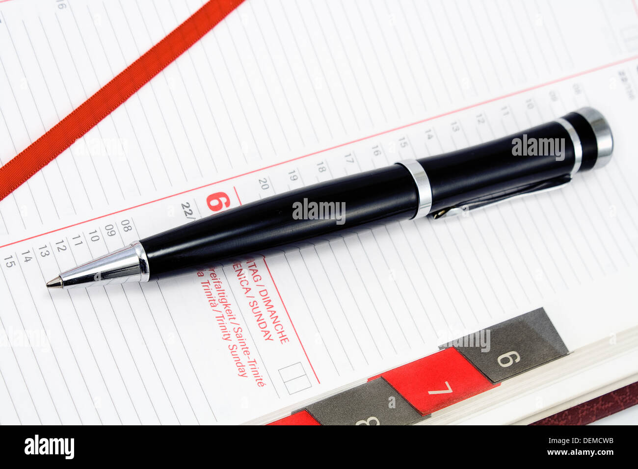 Pen on personal organizer Stock Photo - Alamy