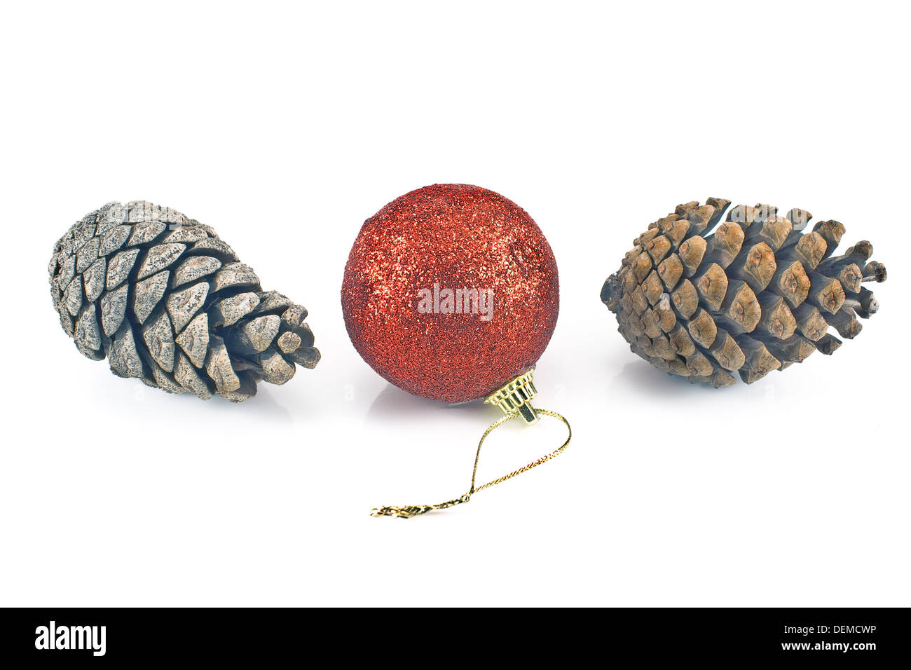 Red Christmas bauble with pine cones isolated on white Stock Photo