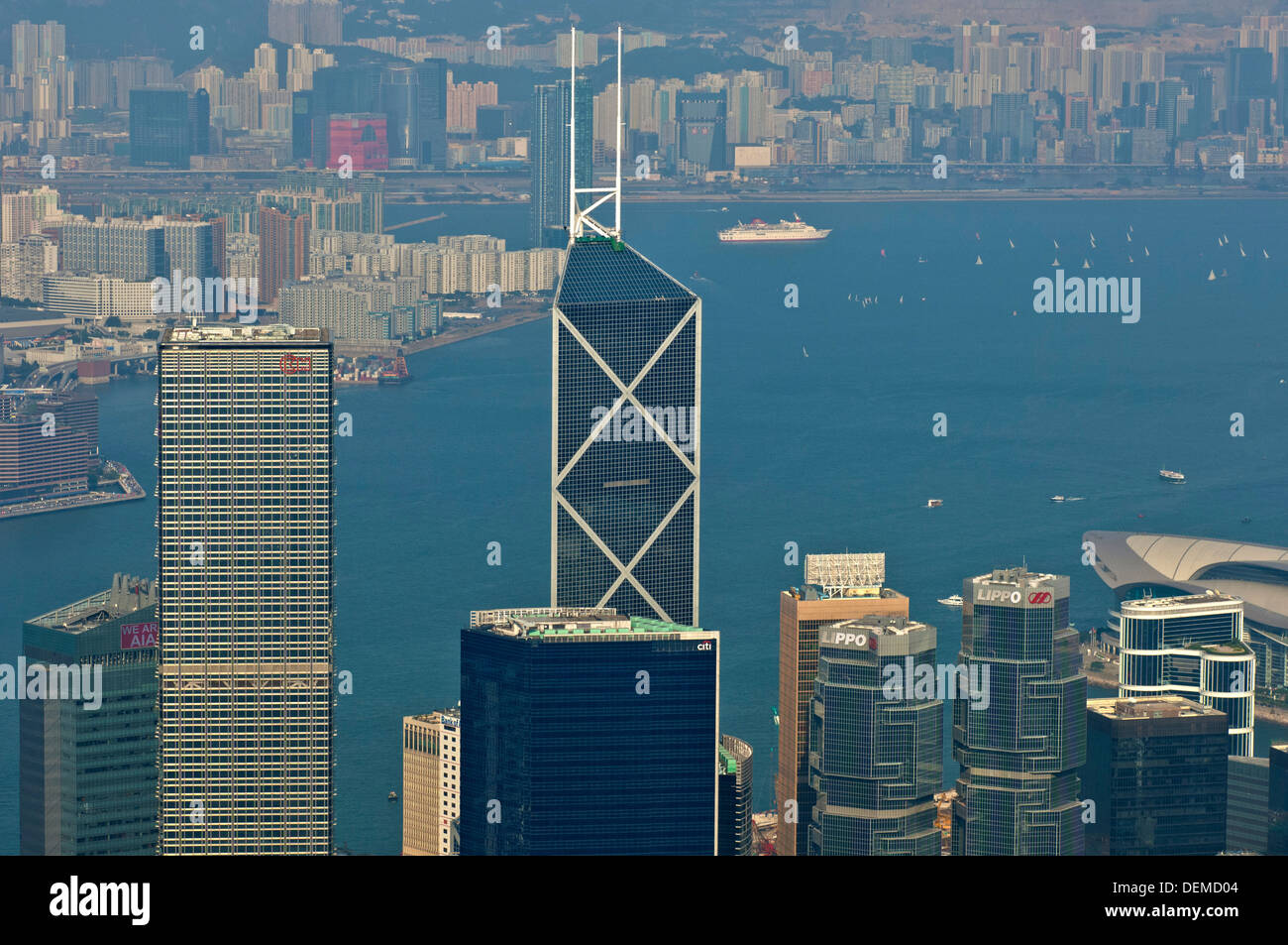 High-rising business buildings and the Bank of China Tower in the Central District against the Victoria Harbour, Hong Kong Stock Photo