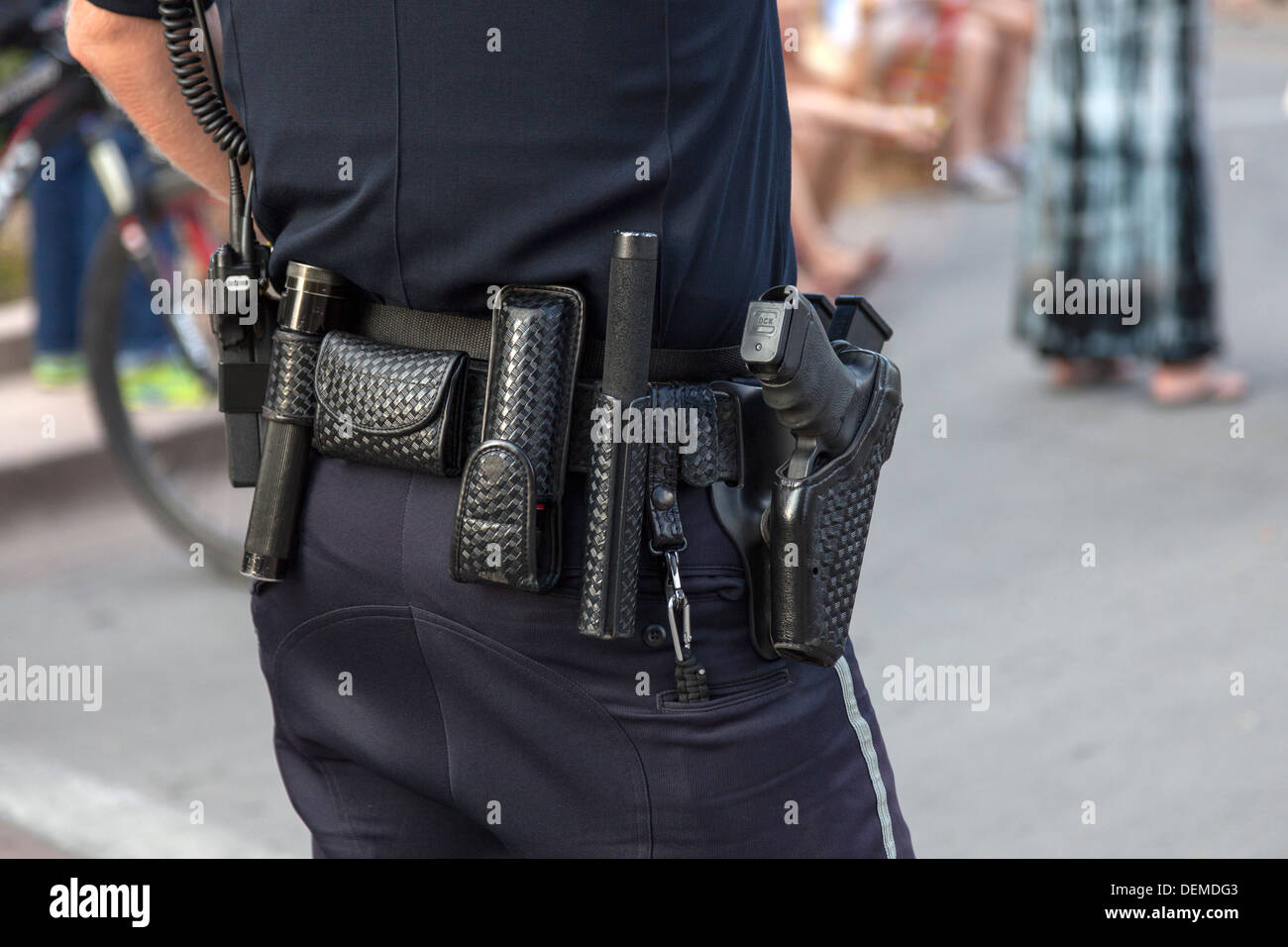 Equipment belt of an American uniformed Police Office showing his gun and baton, Colorado, USA Stock Photo