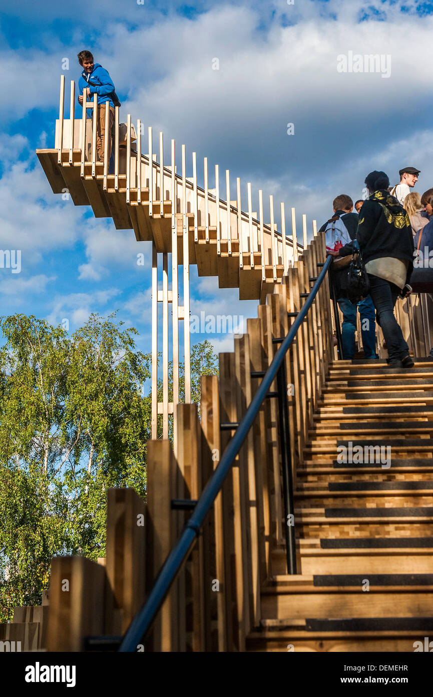 London, UK. 20th Sep, 2013. Endless Stair: commissioned for the London Design Festival, it invites visitors to climb and explore a series of 15 Escher-like interlocking staircases made from a prefabricated construction using 44 cubic metres of American tulipwood donated by AHEC members.  It was designed by Alex de Rijke, Co-Founder of dRMM Architects and Dean of Architecture at the Royal College of Art, working closely with engineers at Arup. Tulipwood is a plentiful and sustainable American hardwood export, and is being used for the first time as cross-laminated timber. © Guy Bell/Alamy Live Stock Photo