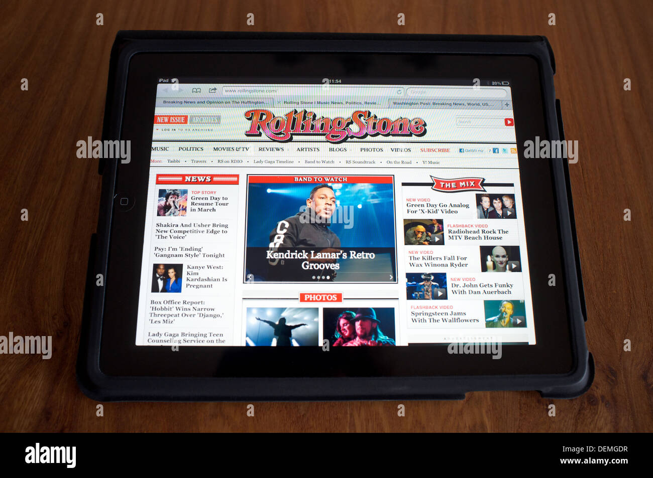 Apple iPad tablet computer displaying Rolling Stone magazine homepage Stock Photo