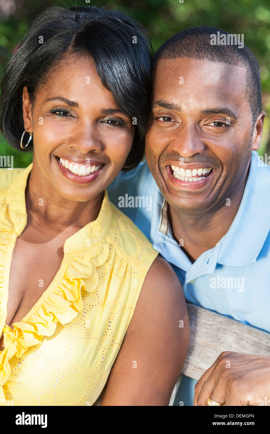 A young African American woman & man couple outside in the summer Stock Photo