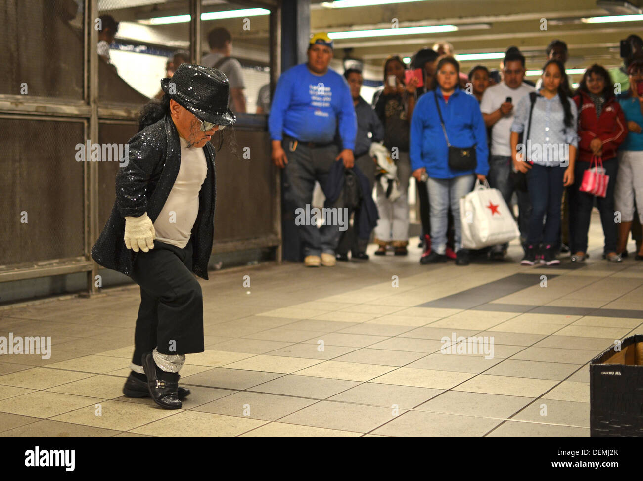 Alex, a little person Michael Jackson impersonator performs before a crowd at the 74th Street Subway Station in Queens, New York Stock Photo