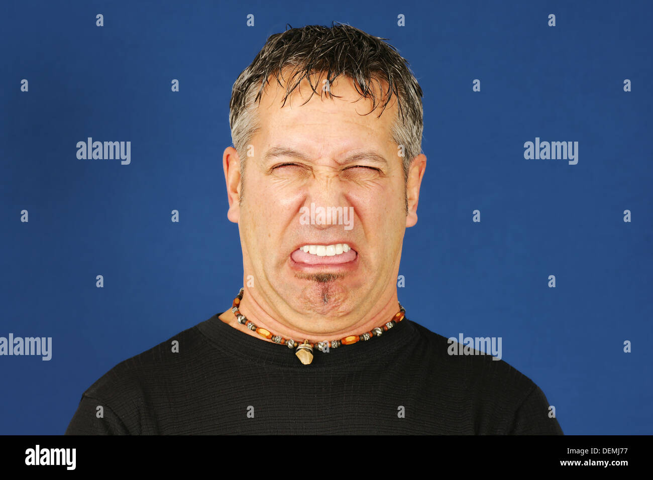 Man with funny disgusted face Stock Photo