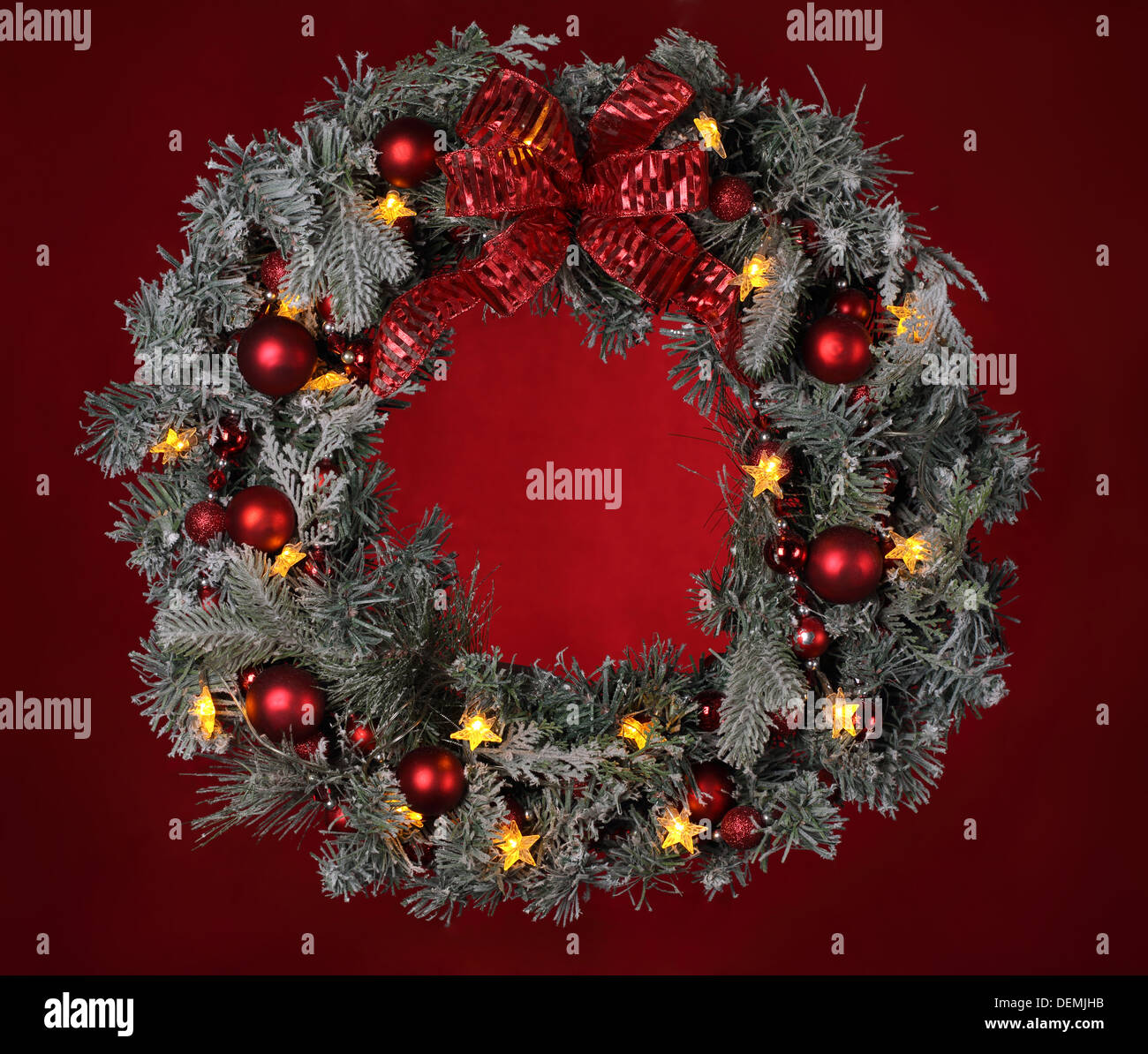 Christmas wreath on red background Stock Photo - Alamy