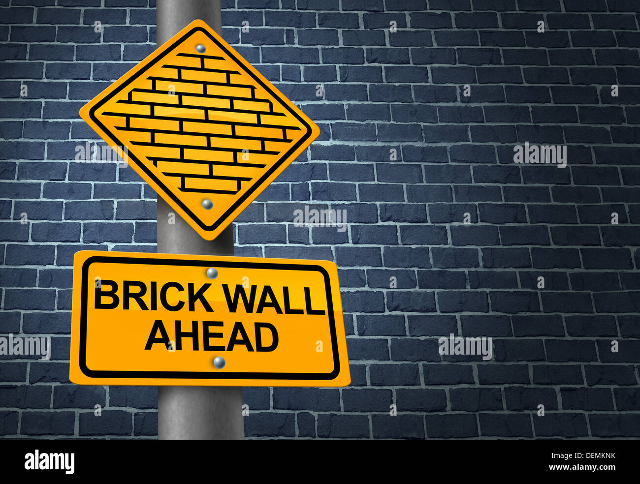 Against A Brick Wall business concept of hardship and difficult restrictions faced on a journey focused on success represented by a yellow traffic sign warning of a future challenging obstacle that will obstruct the planned strategy. Stock Photo