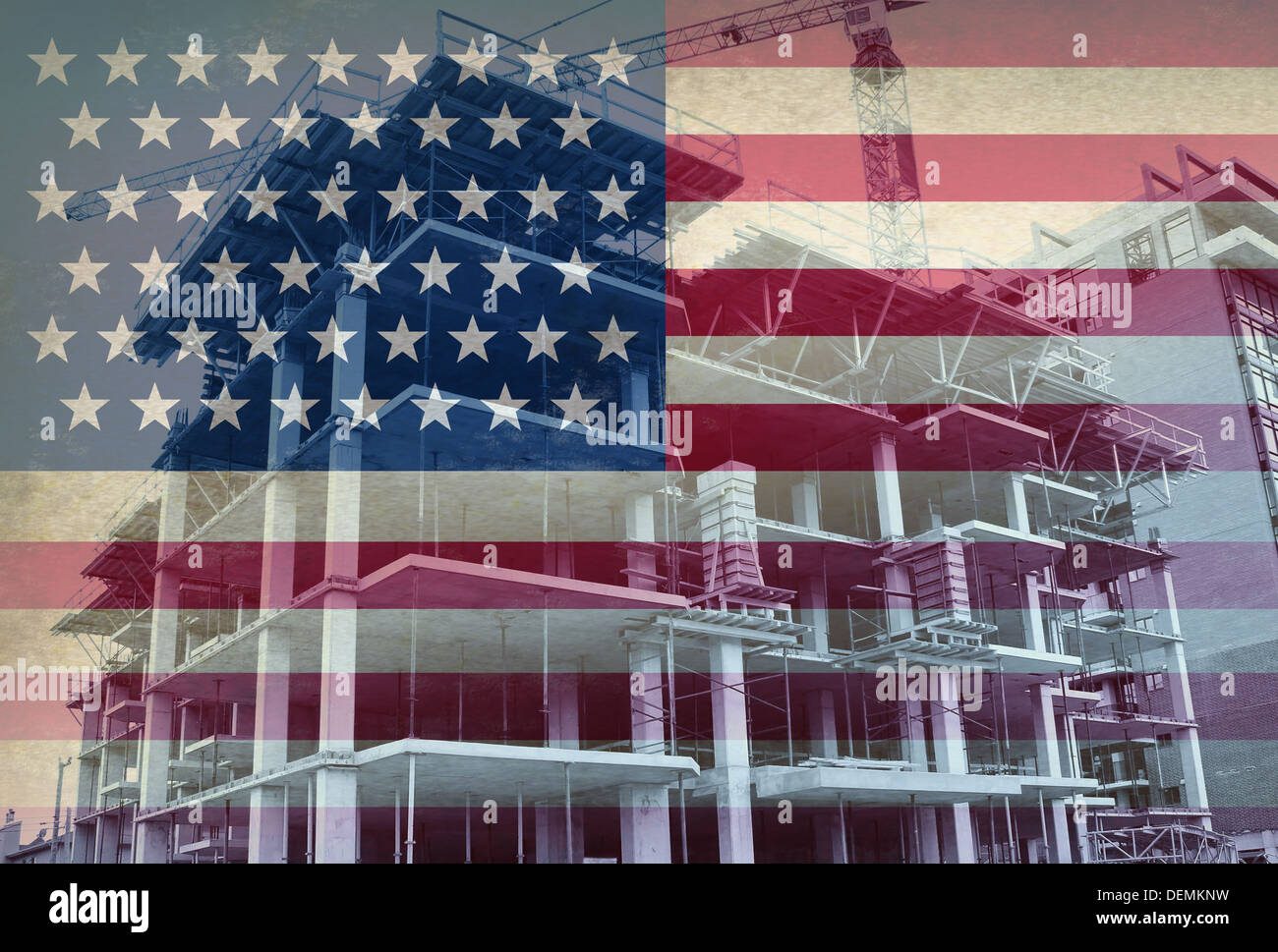 American Economic Development business and industry concept with the flag of the United States and a construction site with a concrete structure in the process of being built with a tower crane as a commercial real estate building. Stock Photo