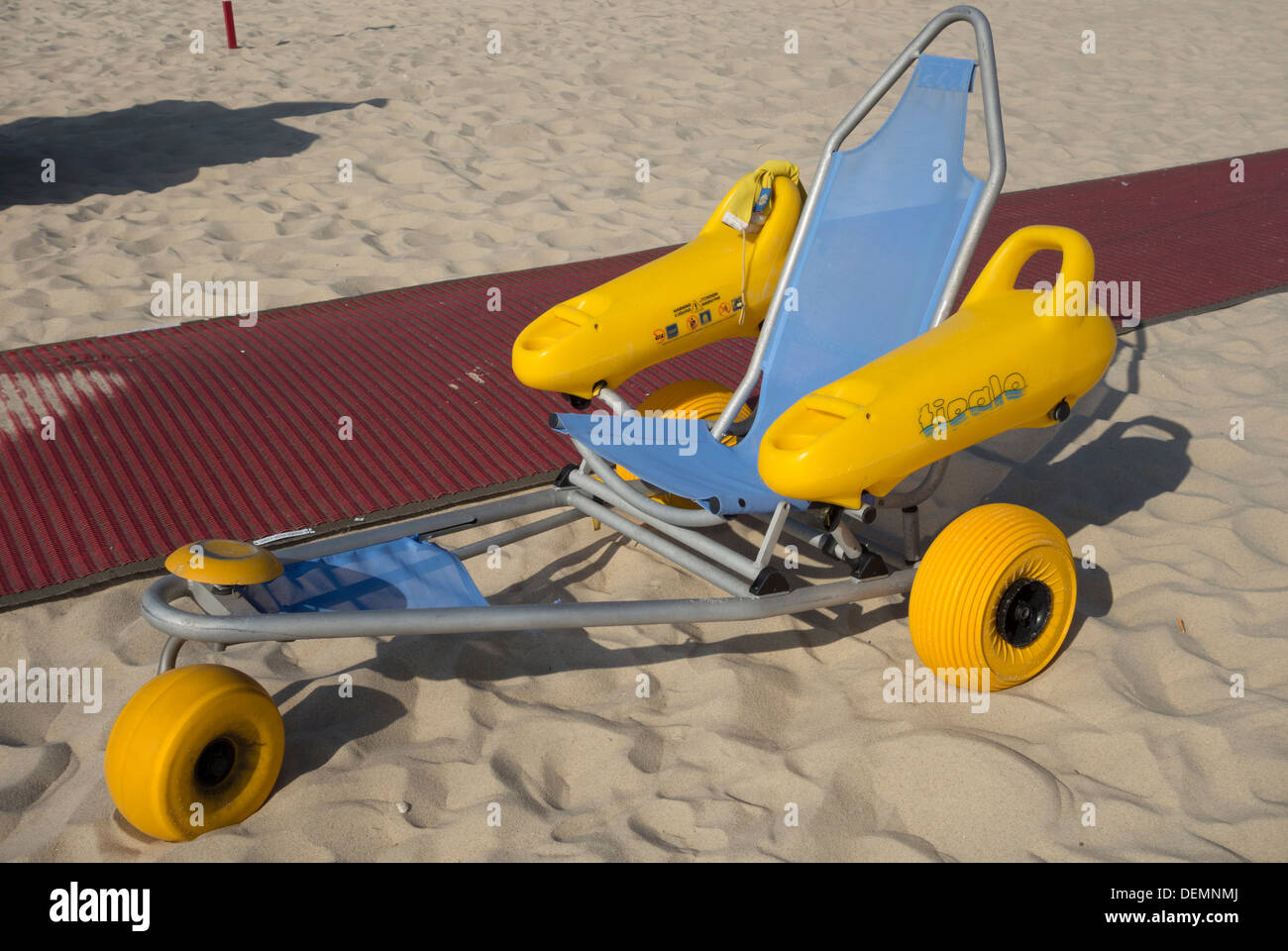 Wheelchair used to allow disabled people to enter the water at the beach Stock Photo