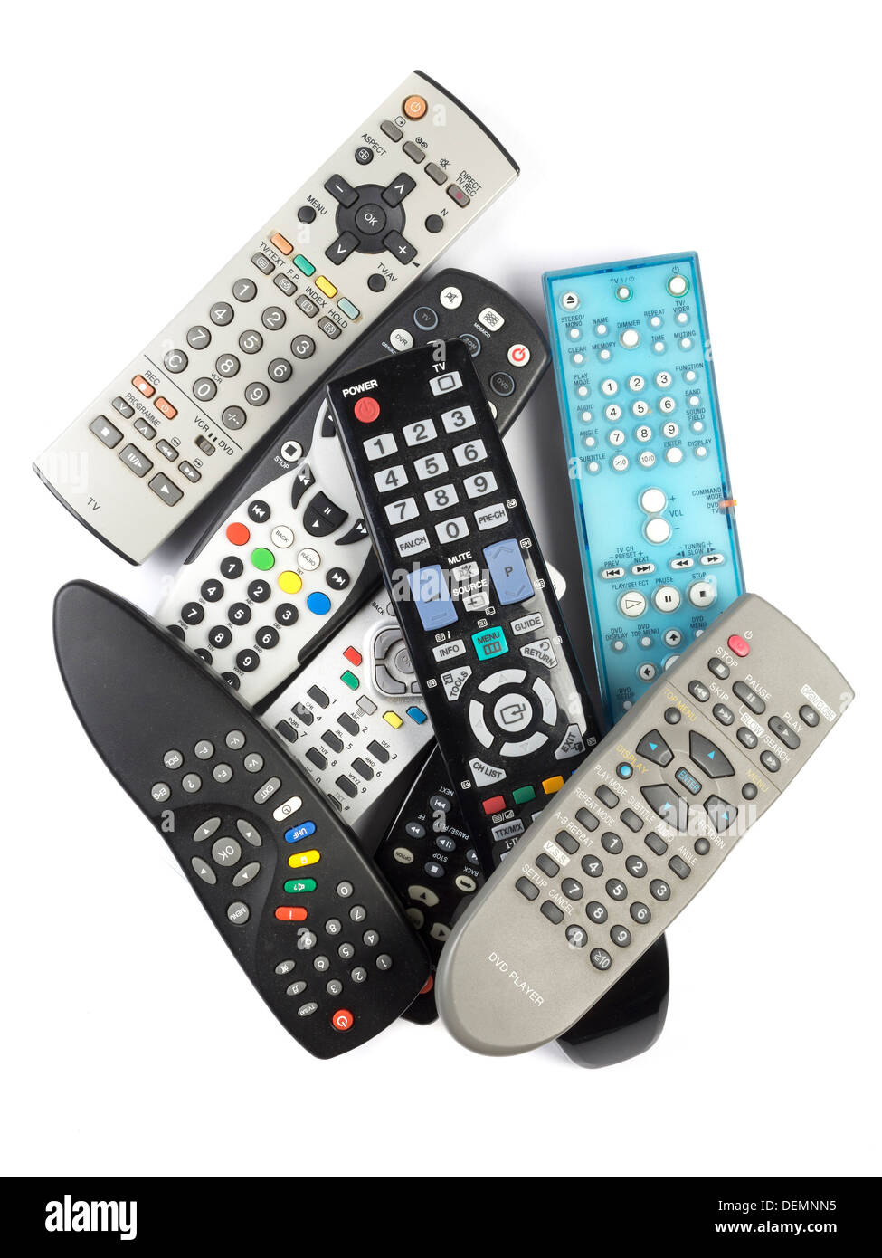 Pile of remote controls cut out isolated on white background Stock Photo