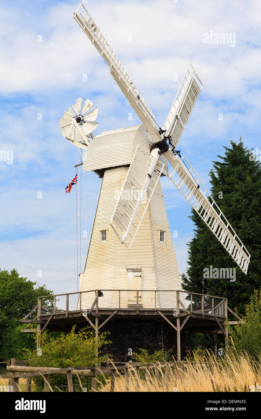 19th century Kentish smock mill restored and working white wooden windmill in Woodchurch, Kent, England, UK, Britain Stock Photo
