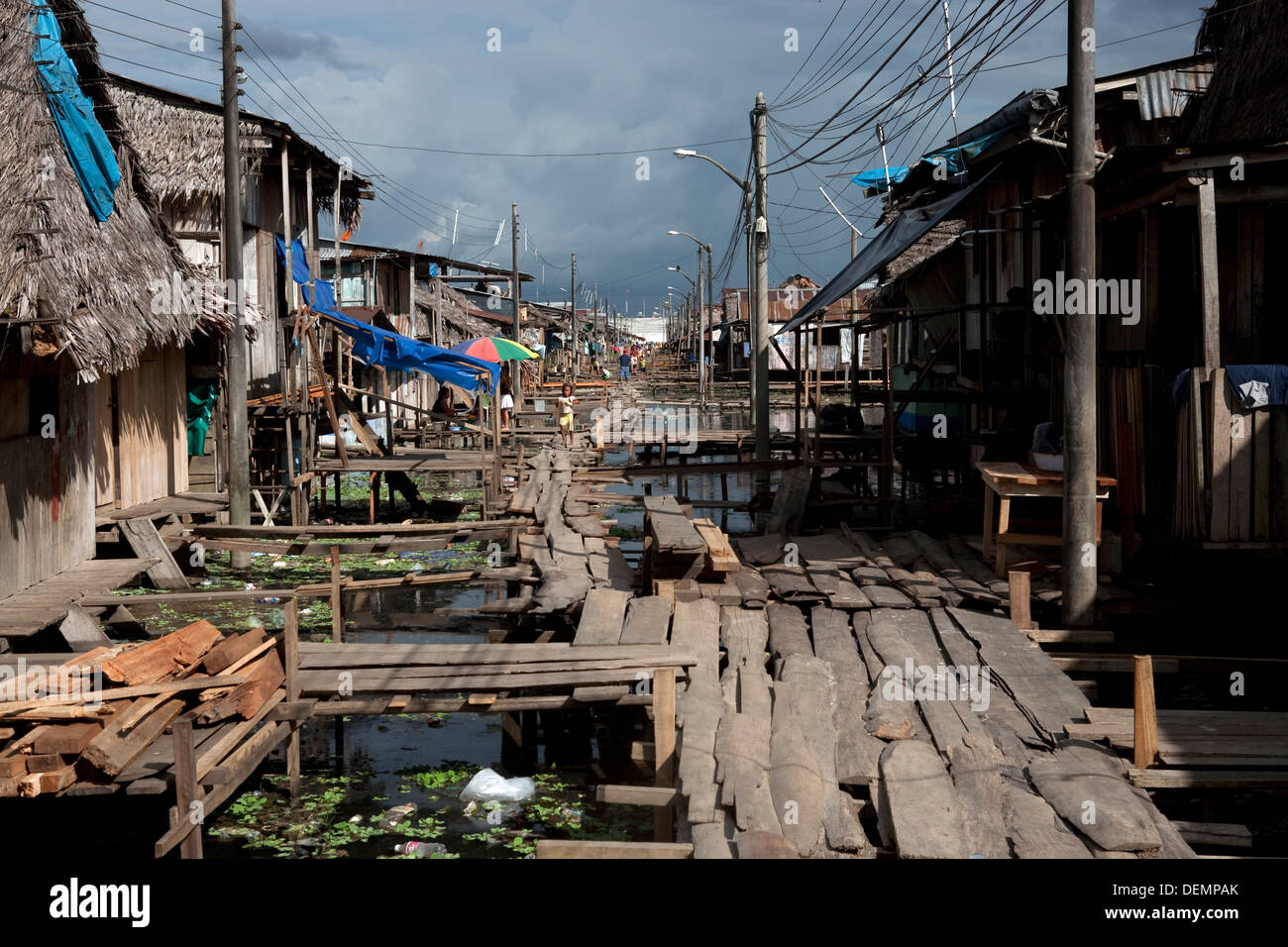 Wooden walkways to prevent floodwaters of the Amazon River in one of the poorest neighborhoods in Iquitos. Stock Photo