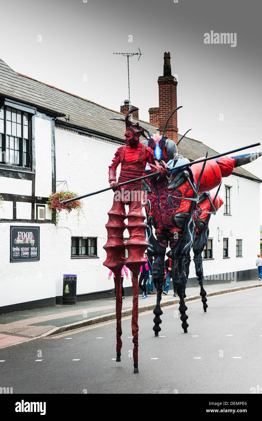 Witham, Essex, UK. 21st September 2013. The XL Insects enter the High Street to begin their performance at the Witham International Puppet Festival.  Photographer: Gordon Scammell/Alamy Live News Stock Photo
