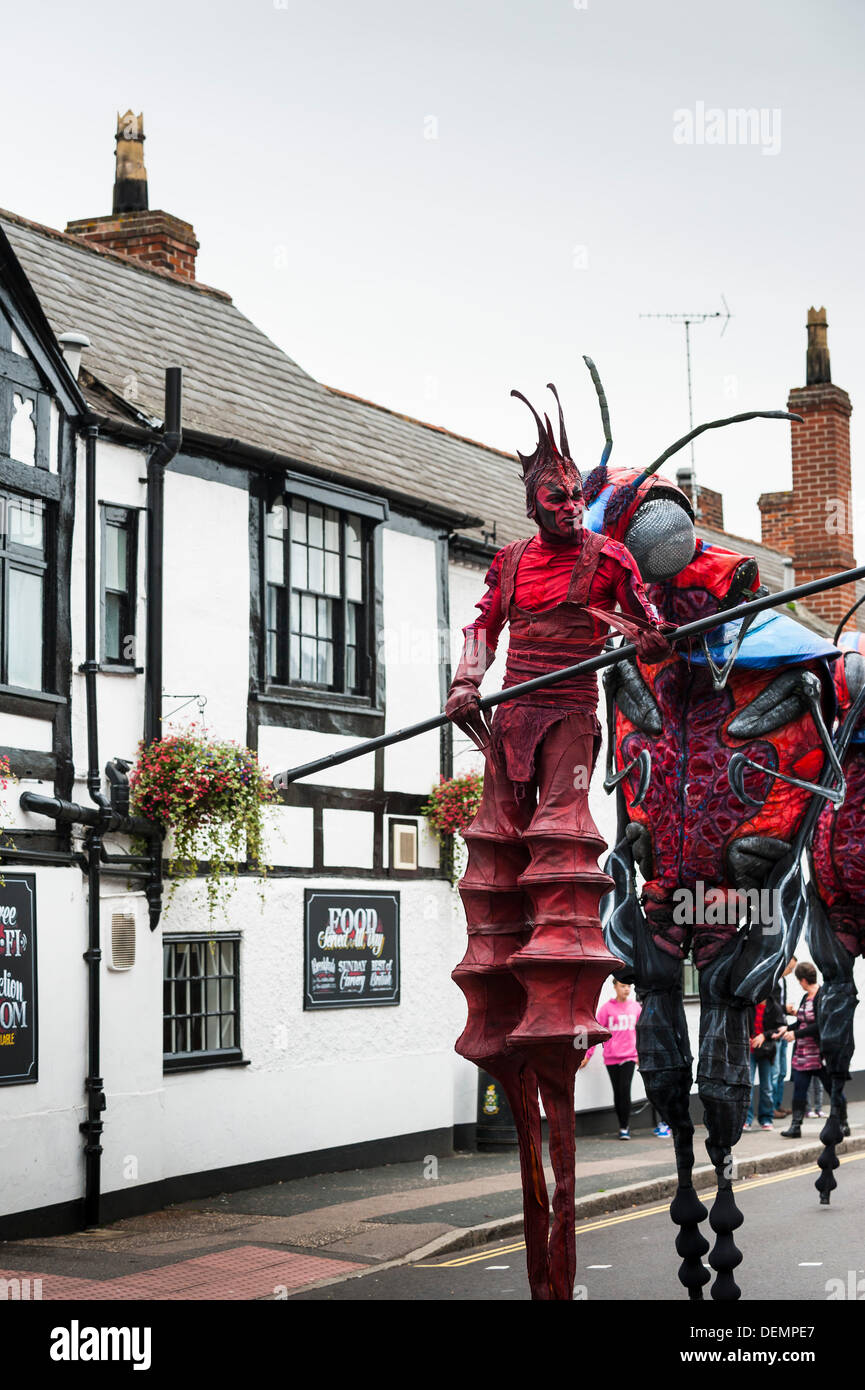 Witham, Essex, UK. 21st September 2013. The XL Insects enter the High Street to begin their performance at the Witham International Puppet Festival.  Photographer: Gordon Scammell/Alamy Live News Stock Photo