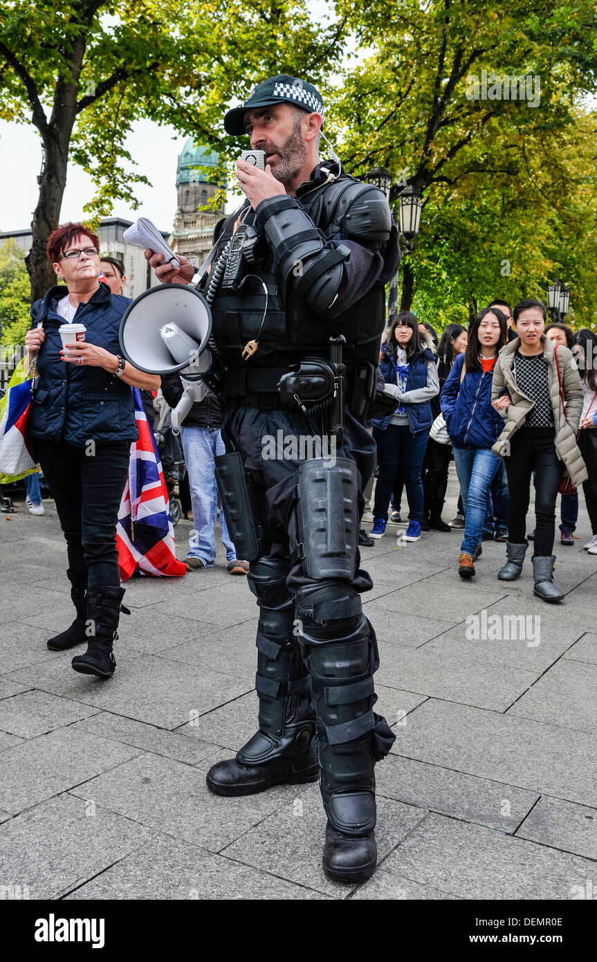 Belfast, Northern Ireland, 21st September 2013 - A PSNI Chief Inspector issues a warning to the gathered crowd that any parade they take part in will be illegal, and they will be liable to arrest. Credit:  Stephen Barnes/Alamy Live News Stock Photo