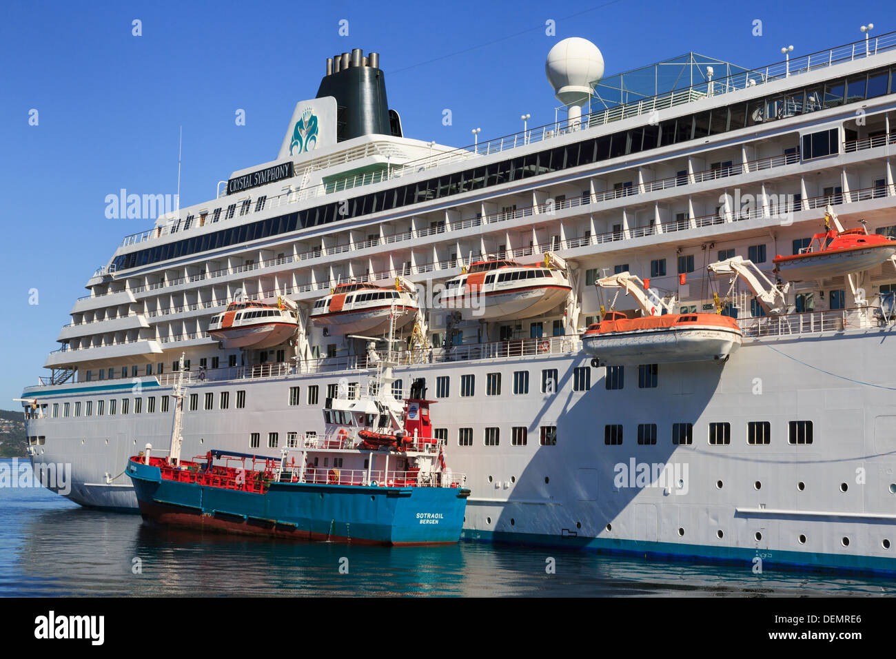 Supply boat by ocean cruise ship liner Crystal Symphony docked in Vågen harbour, Bergen, Hordaland, Norway, Scandinavia Stock Photo