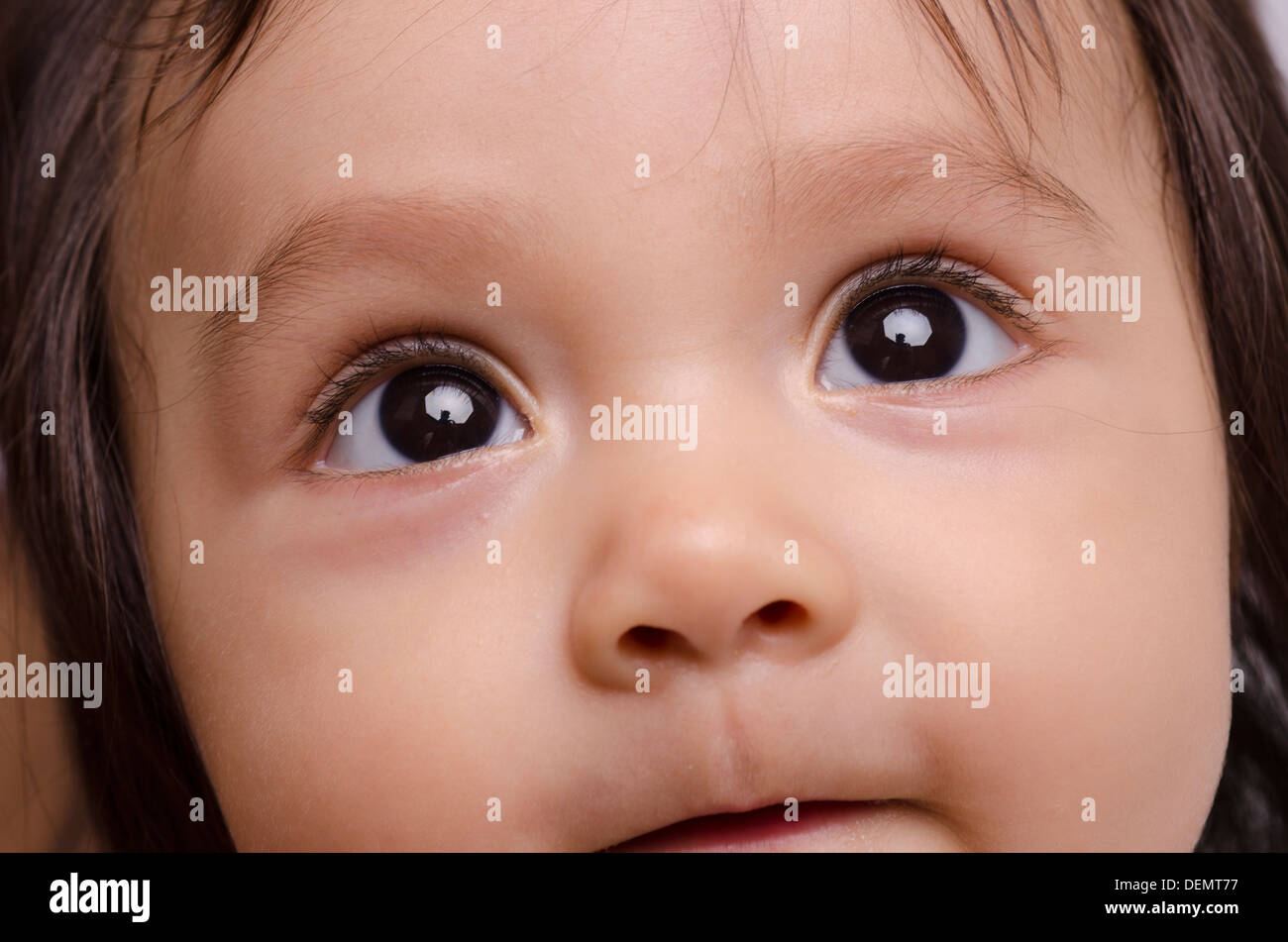 Baby eyes looking up happy Stock Photo Alamy