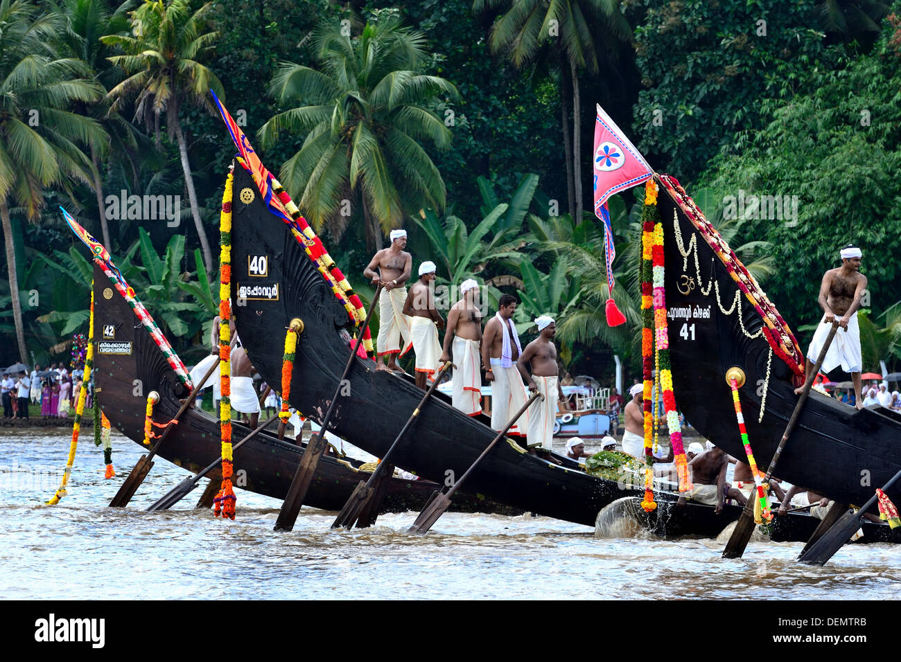 The Aranmula Boat Race the oldest river boat fiesta in Kerala, the south western State of India is held during Onam (August-September). It takes place at Aranmula, near a Hindu temple dedicated to Lord Krishna and Arjuna. The snake boats move in pairs to the rhythm of full-throated singing and shouting watched by an exciting crowd. Stock Photo