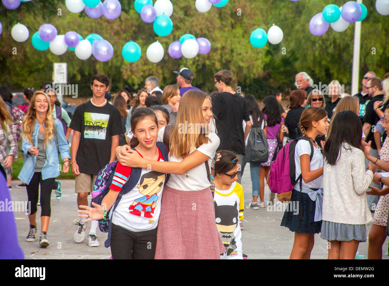 Multiethnic Middle School Girls Greet Each Other On The First Day Of multiethnic-middle-school-girls-greet-each-other-on-the-first-day-of