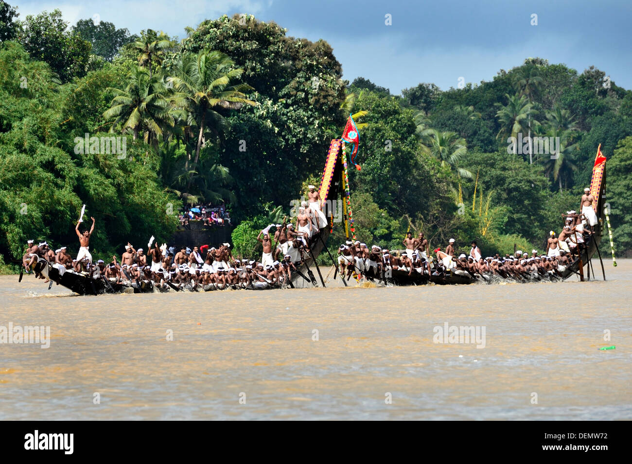The Aranmula Boat Race the oldest river boat fiesta in Kerala, the south western State of India is held during Onam (August-September). It takes place at Aranmula, near a Hindu temple dedicated to Lord Krishna and Arjuna. The snake boats move in pairs to the rhythm of full-throated singing and shouting watched by an exciting crowd. Stock Photo