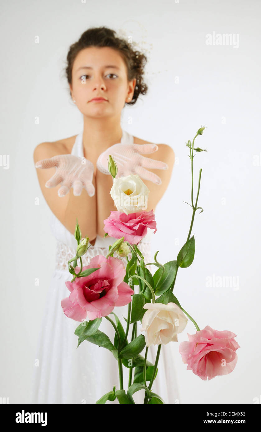 Close-up of flowers and a bride behind Stock Photo
