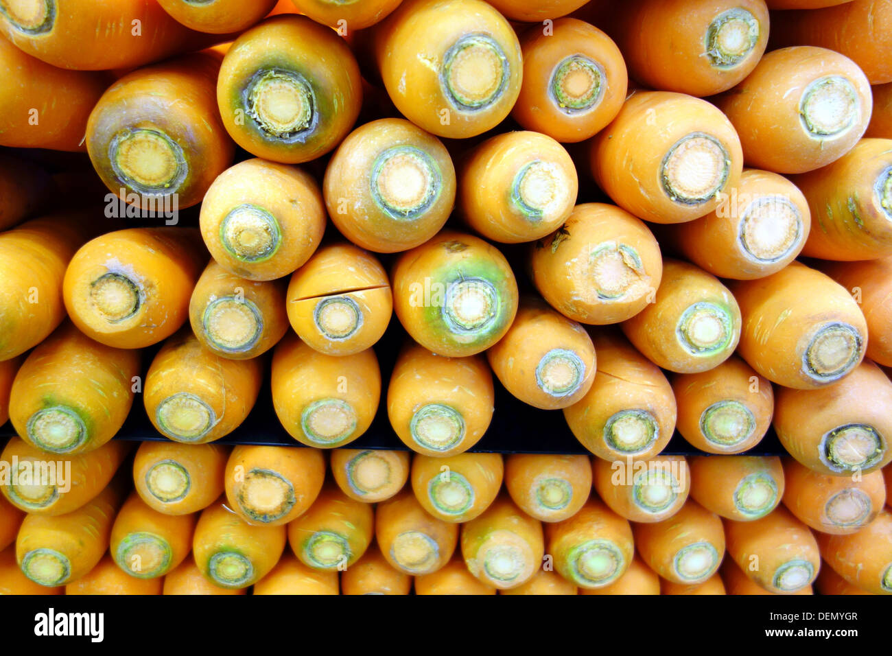 Pile of giant carrots in a supermarket in Toronto Stock Photo