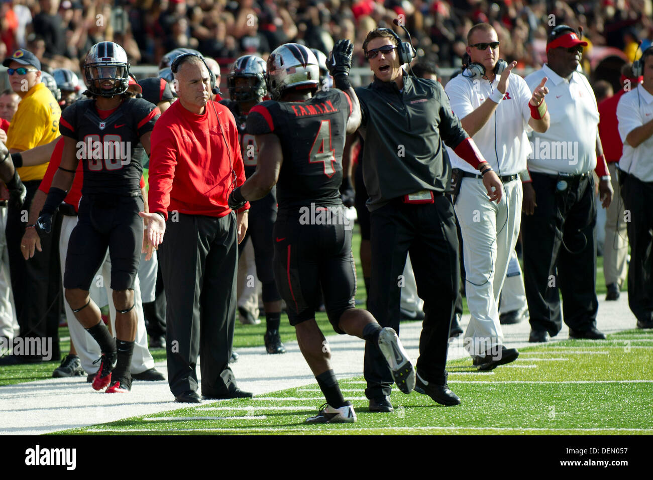 Piscataway, New Jersey, USA. 21st Sep, 2013. September 21, 2013: Rutgers Scarlet Knights head coach Kyle Flood congratulates Rutgers Scarlet Knights wide receiver Leonte Carroo (4) after the Scarlet Knights scored a touchdown late in the first half during the game between Arkansas Razorbacks and Rutgers Scarlet Knights at Highpoint Solutions Stadium in Piscataway, NJ. Credit:  csm/Alamy Live News Stock Photo