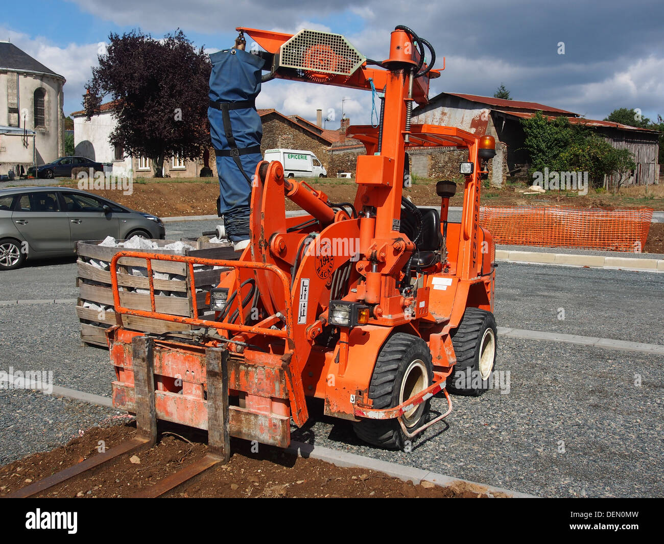 The Transmanut ETP 2004L is a specialized kerb laying machine used in ...