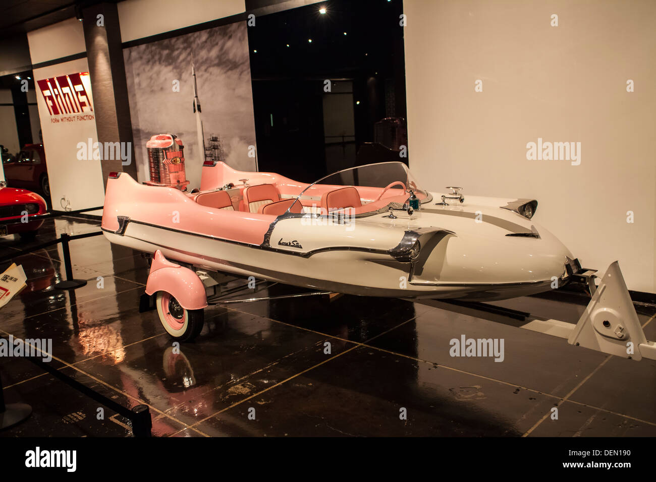1956 Lone Star Meteor a pretty pink Motor and boat with fins as was the style in the fifties at the Petersen Museum in LA Stock Photo