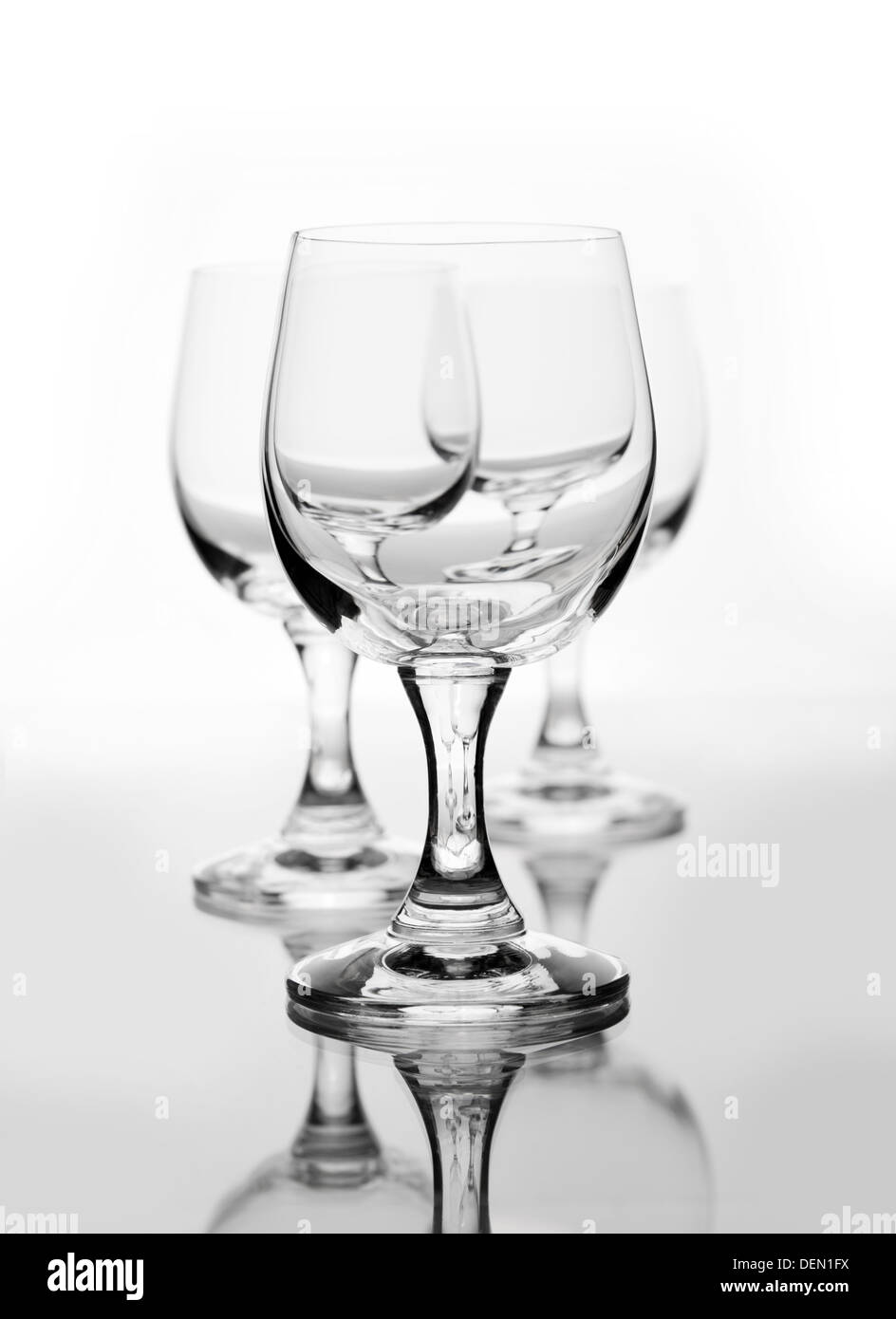 Three empty wine glasses on white Stock Photo