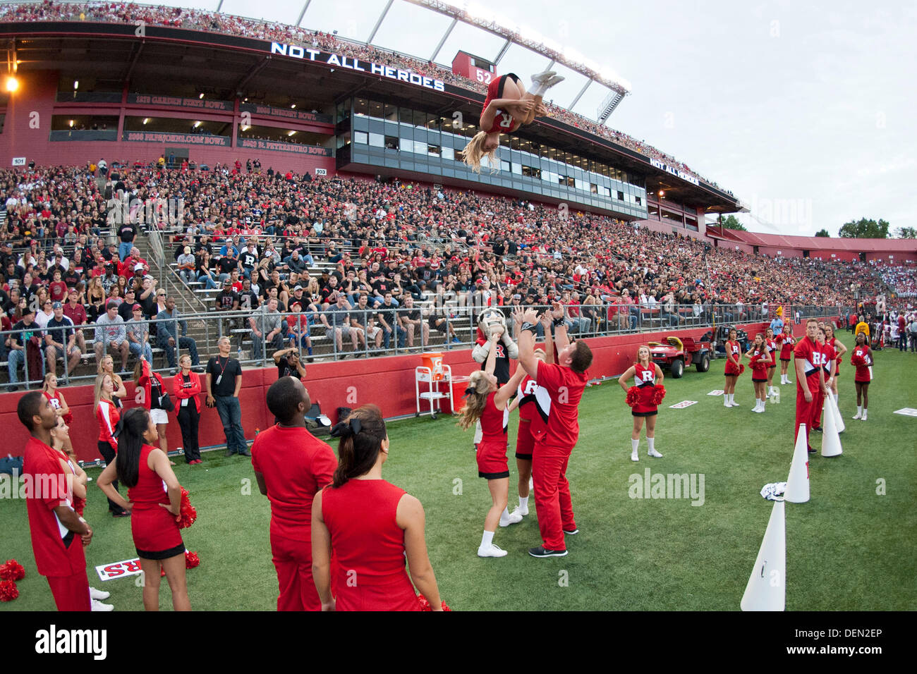 Piscataway, New Jersey, USA. 21st Sep, 2013. September 21, 2013: A Rutgers Scarlet Knights cheerleader is flipped into the air during the game between Arkansas Razorbacks and Rutgers Scarlet Knights at Highpoint Solutions Stadium in Piscataway, NJ. Rutgers Scarlet Knights defeated The Arkansas Razorbacks 28-24. Credit:  csm/Alamy Live News Stock Photo