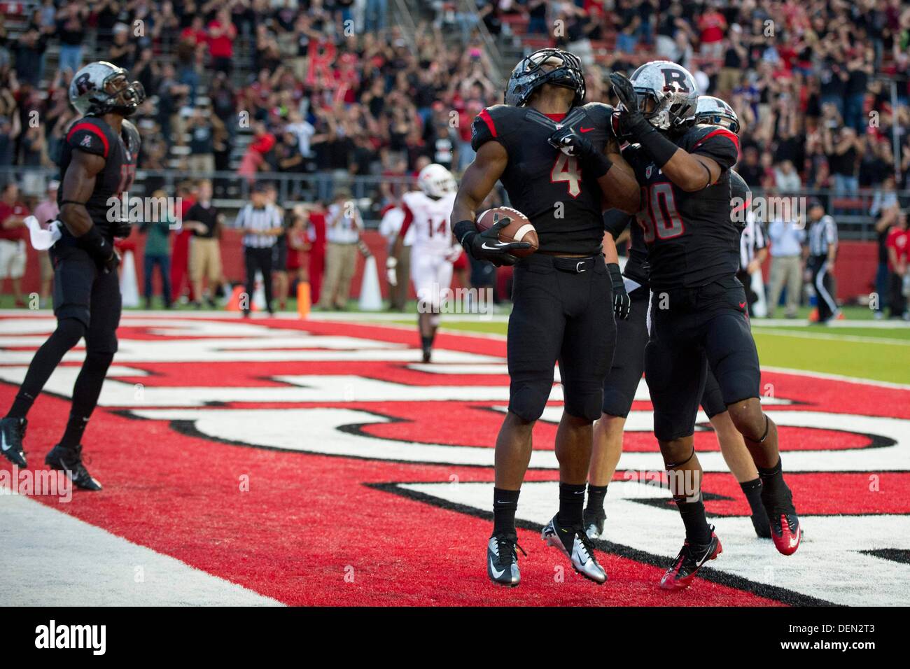 Piscataway, New Jersey, USA. 21st Sep, 2013. September 21, 2013: Rutgers Scarlet Knights wide receiver Leonte Carroo (4) celebrates after scoring a touchdown during the game between Arkansas Razorbacks and Rutgers Scarlet Knights at Highpoint Solutions Stadium in Piscataway, NJ. Rutgers Scarlet Knights defeated The Arkansas Razorbacks 28-24. Credit:  csm/Alamy Live News Stock Photo