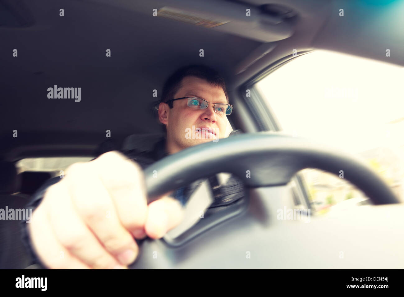 driver behind the steering wheel Stock Photo Alamy