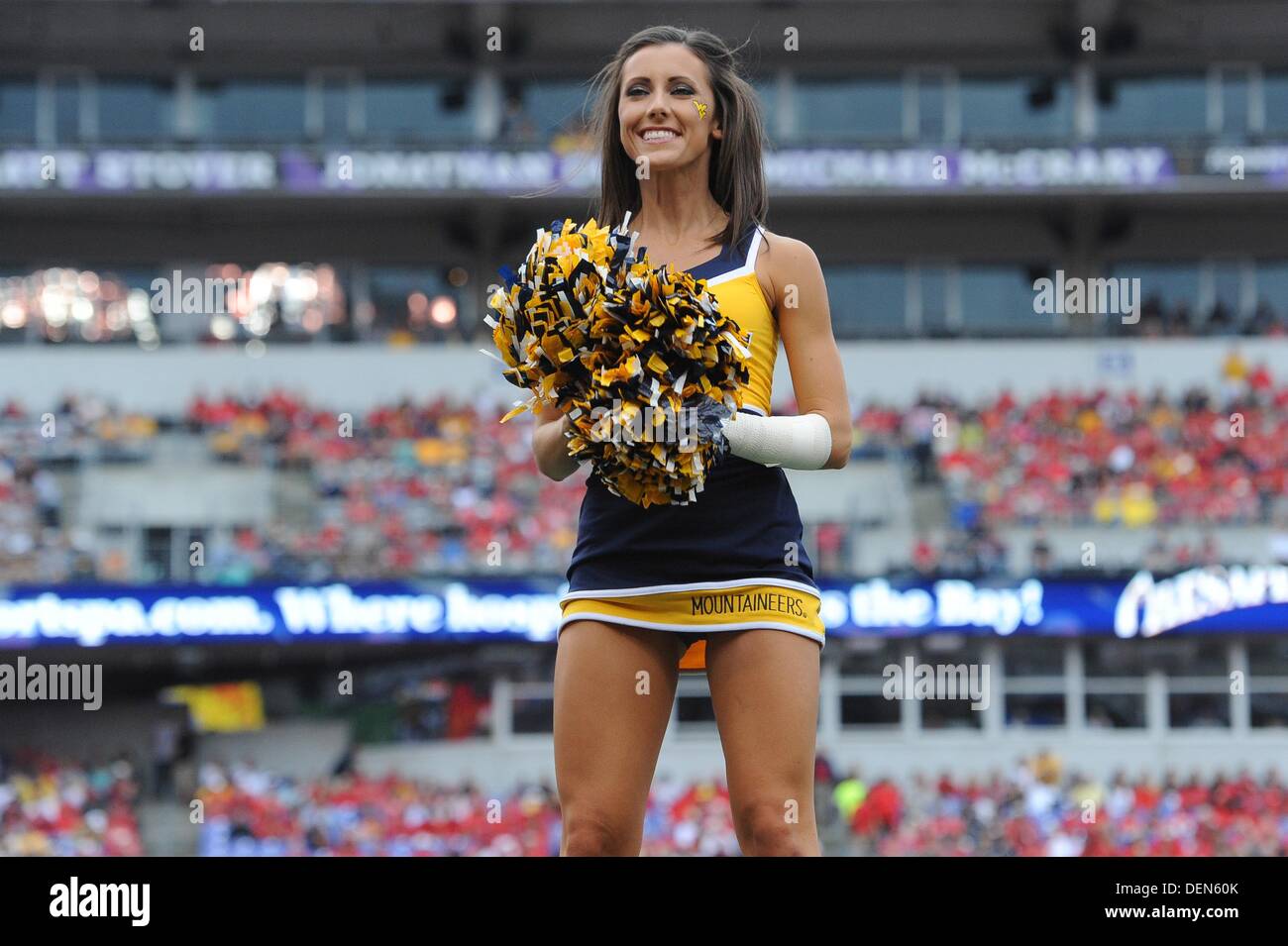 Baltimore, MD, USA. 21st Sep, 2013. A WVA cheerleader performs during a match up between the Maryland Terrapins and the West Virginia Mountaineers at M&T Bank Stadium in Baltimore, MD. The Terrapins shut out the Mountaineers 37-0. Credit:  Cal Sport Media/Alamy Live News Stock Photo