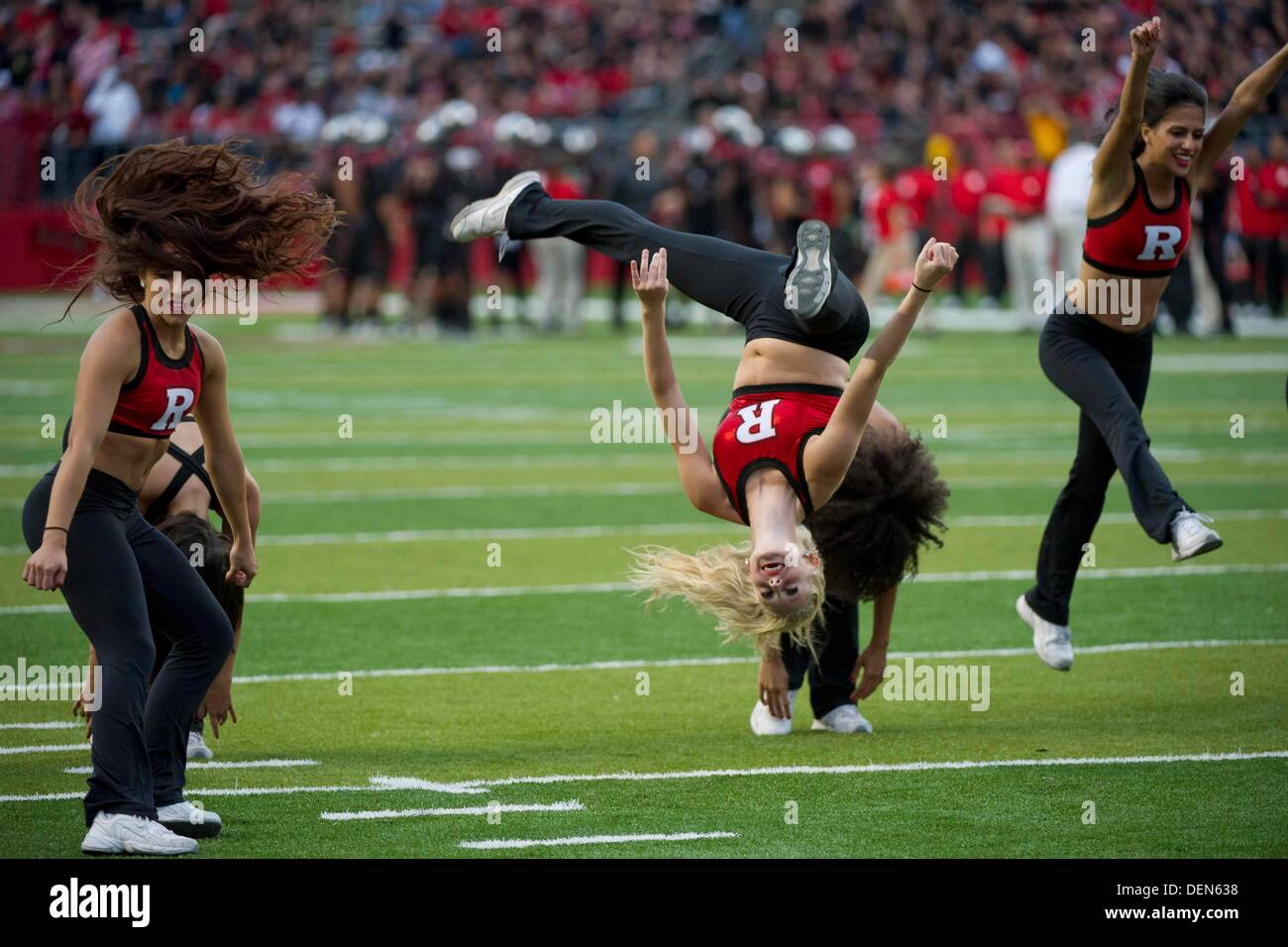 Piscataway, New Jersey, USA. 21st Sep, 2013. September 21, 2013: A Rutgers Scarlet Knights cheerleader is upside down as they perform during the game between Arkansas Razorbacks and Rutgers Scarlet Knights at Highpoint Solutions Stadium in Piscataway, NJ. Rutgers Scarlet Knights defeated The Arkansas Razorbacks 28-24. Credit:  csm/Alamy Live News Stock Photo